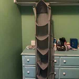 A gray shoe rack